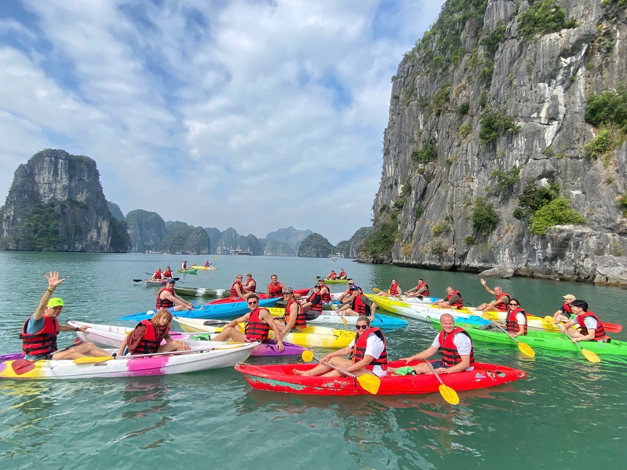 Kayakers moving through Lan Ha Bay