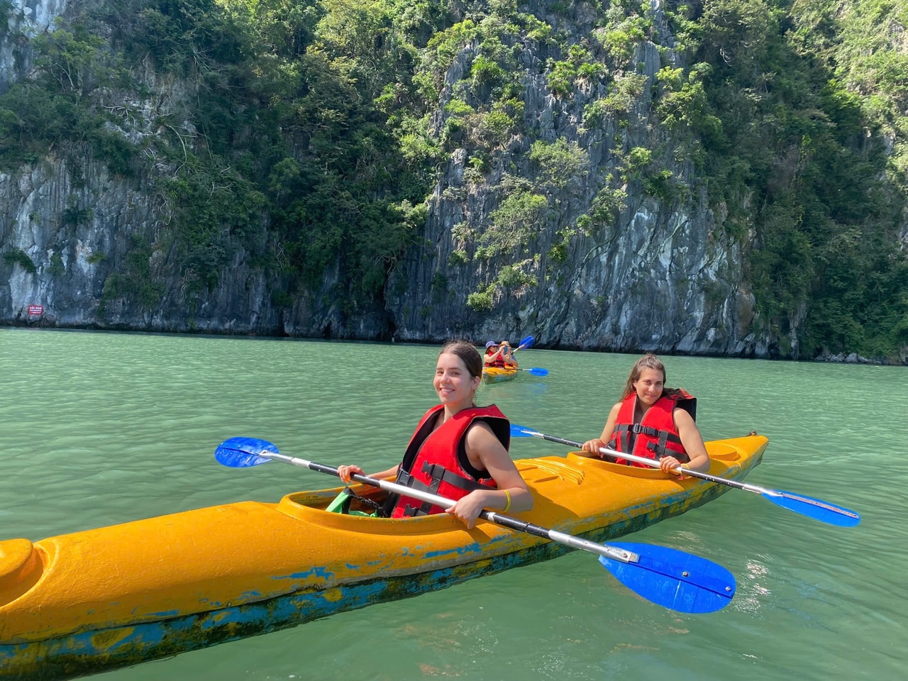 Kayaking between limestone karsts in Lan Ha Bay